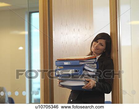 Woman with files View Large Photo Image Stock Photograph - Woman with files. Fotosearch