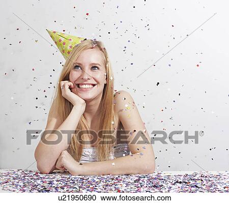 Woman with funny hat and confetti View Large Photo Image Stock Image - Woman with funny hat and confetti. Fotosearch