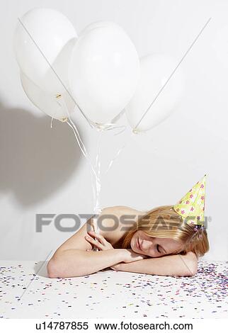 Woman with funny hat and confetti View Large Photo Image Stock Photography - Woman with funny hat and confetti. Fotosearch