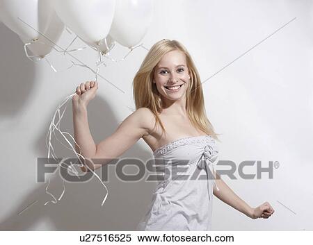 Woman with funny hat and confetti View Large Photo Image Stock Photography - Woman with funny hat and confetti. Fotosearch