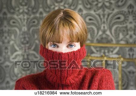 woman with jumper pulled over face View Large Photo Image Picture - woman with jumper pulled over face. Fotosearch