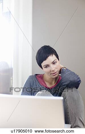 Woman with laptop View Large Photo Image Stock Image - Woman with laptop. Fotosearch