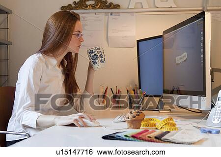 Stock Photograph - Woman working at the computer. Fotosearch
