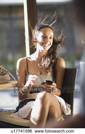 Woman writing a sms View Large Photo Image Stock Photograph - Woman writing a sms. Fotosearch