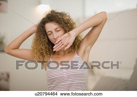 Woman yawning and stretching View Large Photo Image Picture - Woman yawning and stretching. Fotosearch