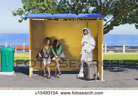 Picture - Women flirting with an astronaut. Fotosearch