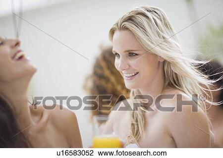 Stock Image - Women having fun in a spa. Fotosearch