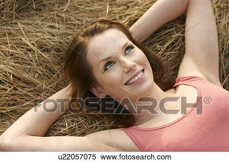 Stock Photography - Women lying on Meadow smiling. Fotosearch