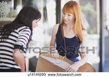 Women on a shopping tour View Large Photo Image Stock Image - Women on a shopping tour. Fotosearch
