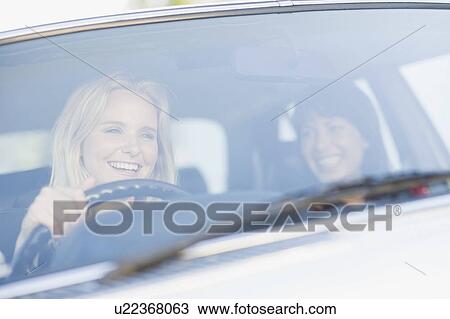 Women sitting in a car View Large Photo Image Stock Image - Women sitting in a car. Fotosearch