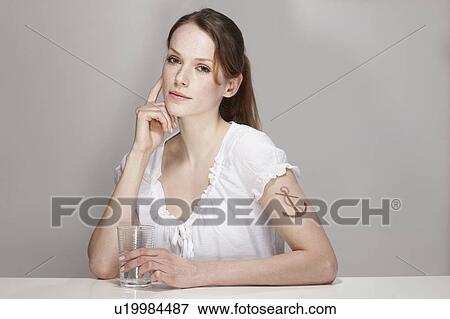 Stock Photo - Women with Anchor Tatoo and Cup Water. Fotosearch