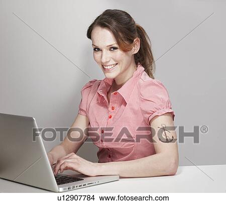 Women with Anchor Tatoo and Laptop View Large Photo Image Picture - Women with Anchor Tatoo and Laptop. Fotosearch