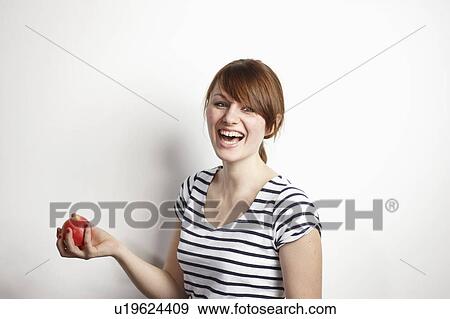 Women with Apple laughing View Large Photo Image Stock Photo - Women with Apple laughing. Fotosearch
