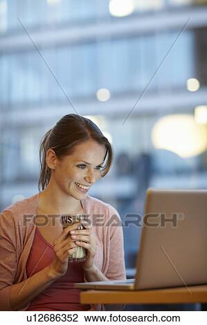 Women with coffee and laptop View Large Photo Image Stock Image - Women with coffee and laptop. Fotosearch