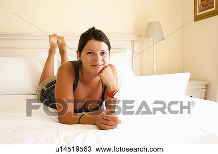 Stock Image - Women with lap top. Fotosearch