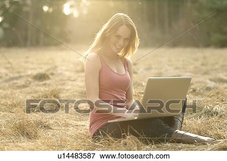 Women with Laptop in Nature View Large Photo Image Stock Photo - Women with Laptop in Nature. Fotosearch