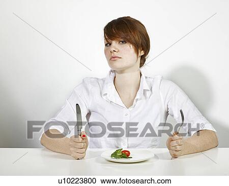 Stock Image - Women with salad in white Shirt. Fotosearch