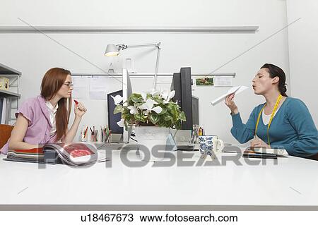 Women working in an office View Large Photo Image Stock Image - Women working in an office. Fotosearch