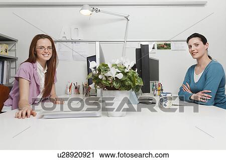 Stock Image - Women working in an office. Fotosearch