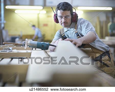 Woodworker in workshop View Large Photo Image Stock Image - Woodworker in workshop. Fotosearch