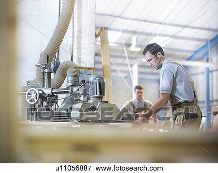 Woodworkers with planing machine View Large Photo Image Stock Photo - Woodworkers with planing machine. Fotosearch