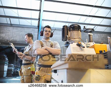 Woodworkers with woodwork machine View Large Photo Image Stock Photo - Woodworkers with woodwork machine. Fotosearch