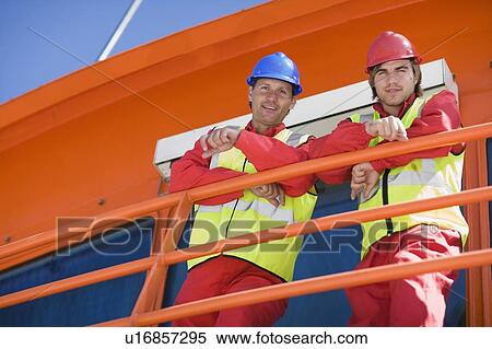 Stock Photography - Worker on a floating bridge. Fotosearch
