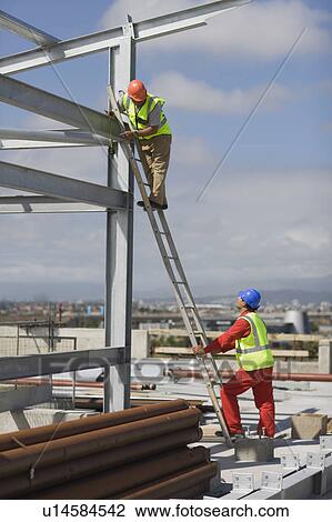 Worker standing on ladder View Large Photo Image Stock Image - Worker standing on ladder. Fotosearch