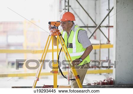 Stock Photography - Worker with measuring equipment. Fotosearch