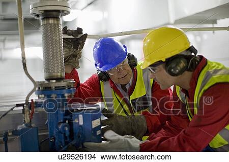 Picture - Workers doing maintenance works. Fotosearch