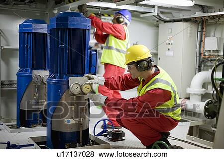 Workers doing maintenance works View Large Photo Image Stock Photo - Workers doing maintenance works. Fotosearch