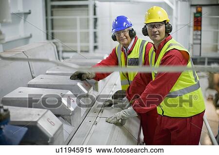 Stock Photography - Workers doing the maintenance of a ship. Fotosearch