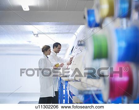Workers making up wiring loom View Large Photo Image Stock Photograph - Workers making up wiring loom. Fotosearch
