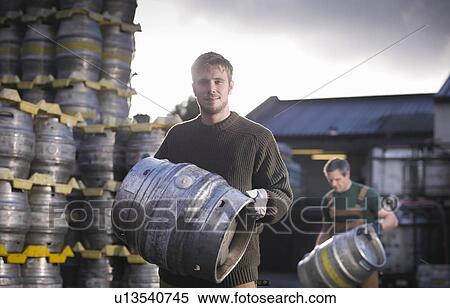 Workers with barrels outside brewery View Large Photo Image Stock Photography - Workers with barrels outside brewery. Fotosearch