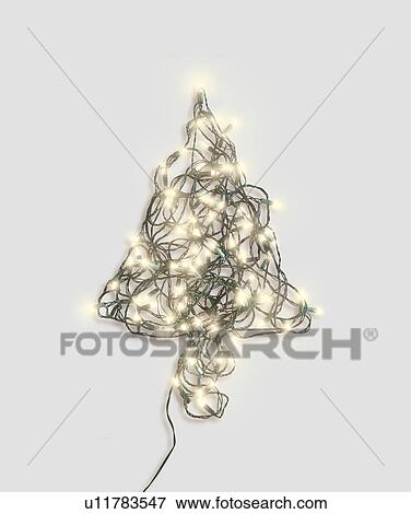 Xmas tree shape made up of fairy lights View Large Photo Image Stock Photo - Xmas tree shape made up of fairy lights. Fotosearch