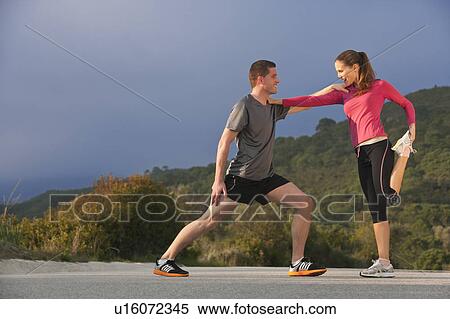 Young athletic couple stretching View Large Photo Image Stock Photography - Young athletic couple stretching. Fotosearch
