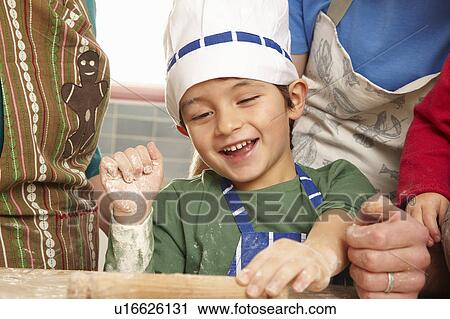 Young boy having fun in kitchen View Large Photo Image Stock Image - Young boy having fun in kitchen. Fotosearch