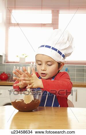 Young boy stirring bowl of chocolate View Large Photo Image Picture - Young boy stirring bowl of chocolate. Fotosearch