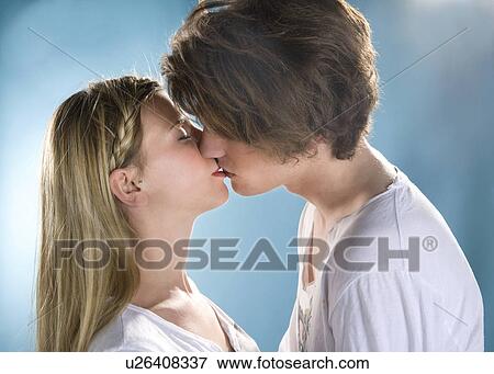 Young couple kiss View Large Photo Image Stock Photo - Young couple kiss. Fotosearch