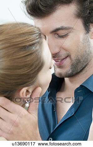 Young couple kissing View Large Photo Image Stock Photo - Young couple kissing. Fotosearch
