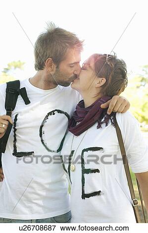 Young couple kissing View Large Photo Image Stock Photo - Young couple kissing. Fotosearch