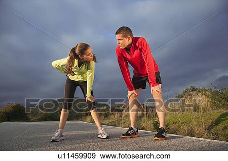 Young couple resting after exercising View Large Photo Image Stock Photo - Young couple resting after exercising. Fotosearch