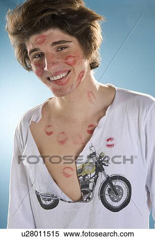 Stock Photography - Young cute man many kisses. Fotosearch
