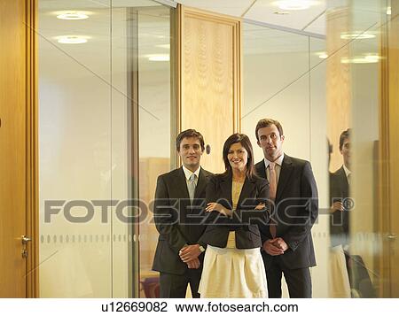 Young executives in corridor View Large Photo Image Stock Image - Young executives in corridor. Fotosearch