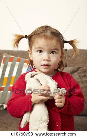 Young girl holding teddy bear View Large Photo Image Stock Image - Young girl holding teddy bear. Fotosearch