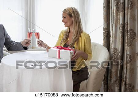 Young wife celebrating with husband View Large Photo Image Stock Photo - Young wife celebrating with husband. Fotosearch