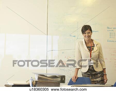 Young woman at desk View Large Photo Image Stock Photography - Young woman at desk. Fotosearch