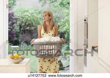Young woman depressed at housework View Large Photo Image Stock Image - Young woman depressed at housework. Fotosearch