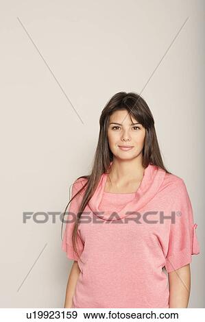 Young woman half smiling View Large Photo Image Stock Photo - Young woman half smiling. Fotosearch