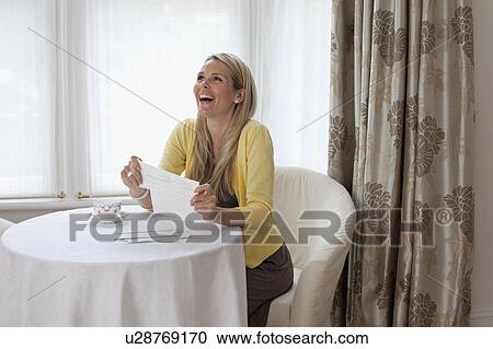Young woman happy about good news View Large Photo Image Stock Image - Young woman happy about good news. Fotosearch